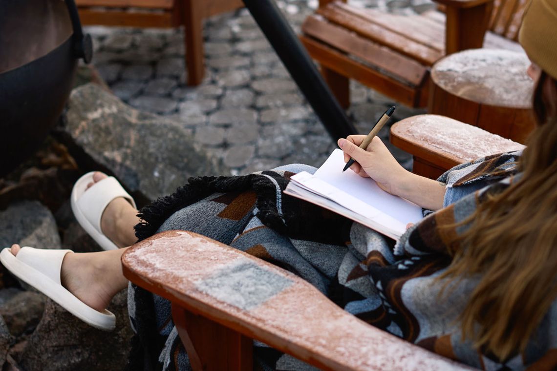 woman journaling at the spa