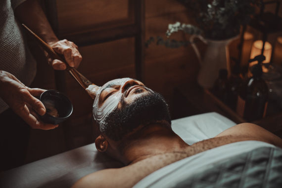 guest enjoying the face care for men treatment