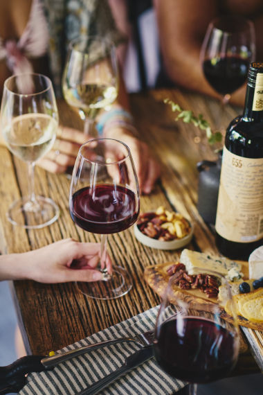 wine glasses and food on a table