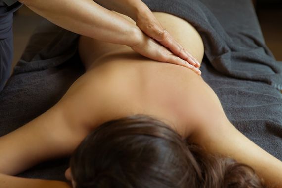 woman enjoying a back massage