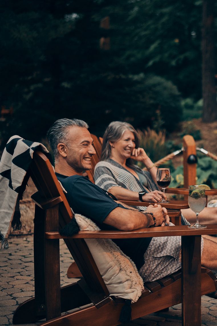 guests relaxing by a fire