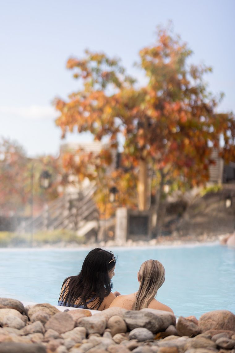 guests relaxing in a bath during fall