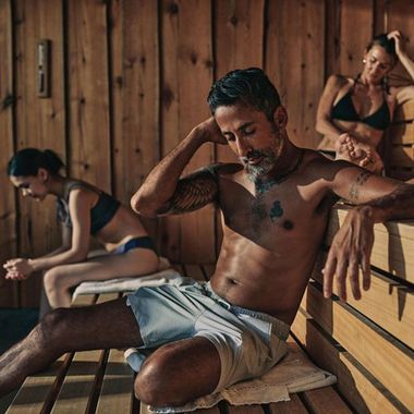 guests sitting in a sauna
