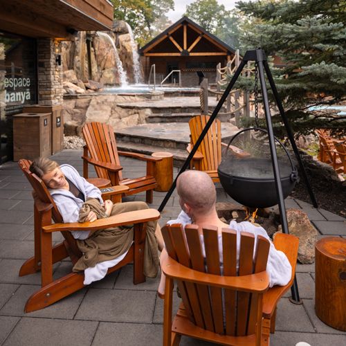 guests sitting by a fireplace