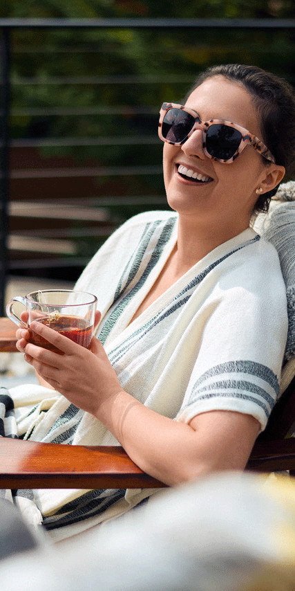 woman holding a cup of tea at the spa