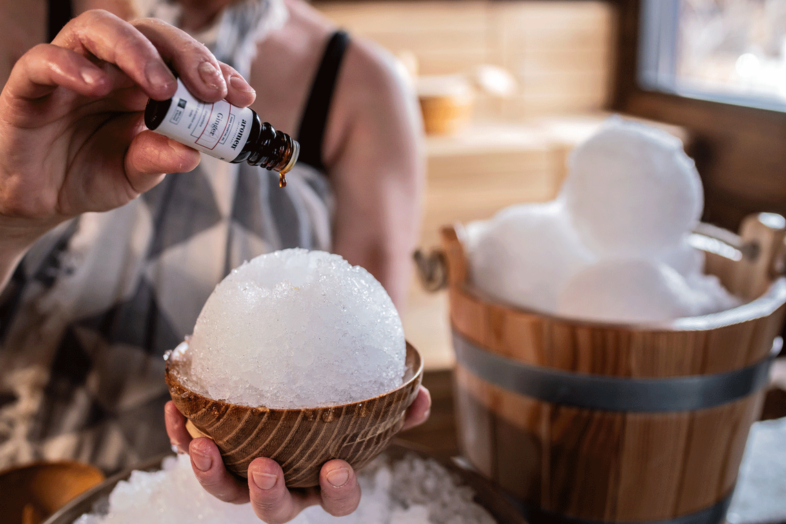 Ritual Artisan pouring essential oil on a snowball