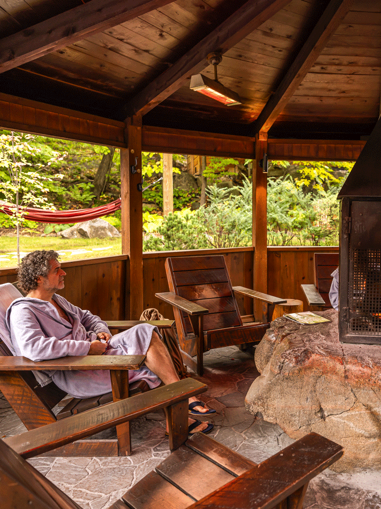 man resting near a fireplace