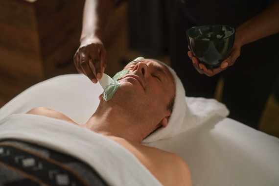 man enjoying a face care treatment