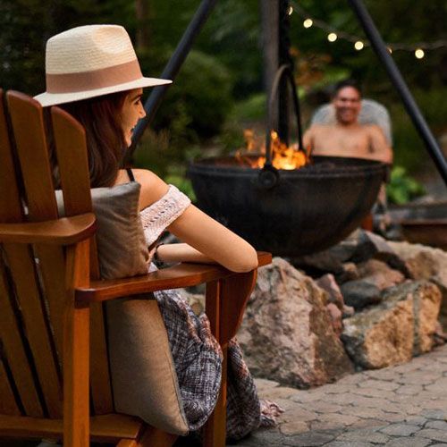 woman sitting by a fire