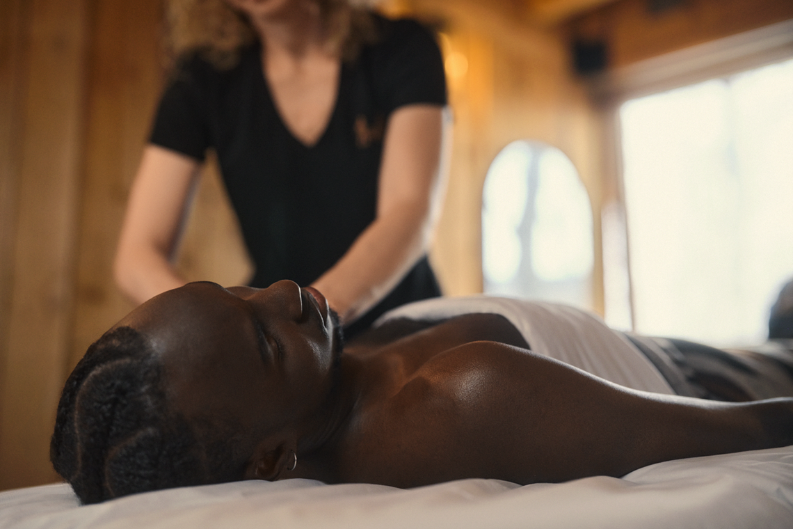 man enjoying a massage in nature