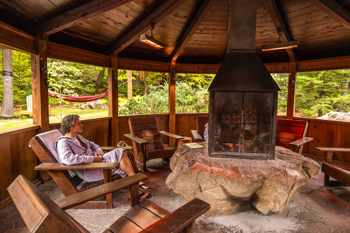 man resting near a fireplace