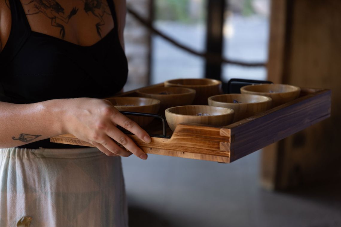 artisan carrying a tray