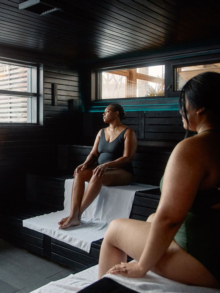 women relaxing in a sauna