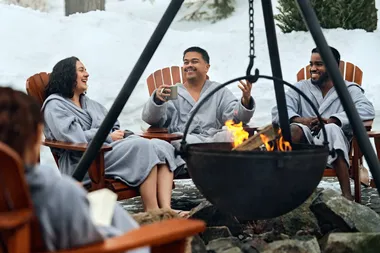 friends around a fire cauldron