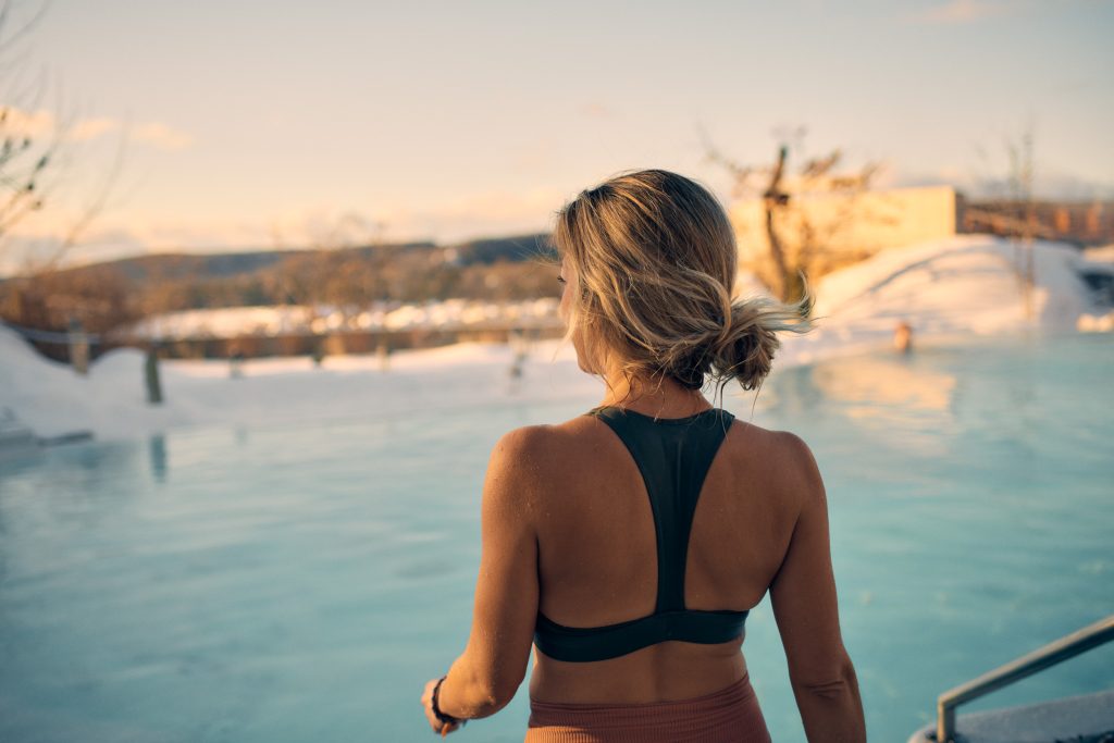 spa goer taking a moment to take in the scenery before plunging into the warm water of the thermal bath