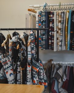 clothing racks stocked with MINI TIPI creations